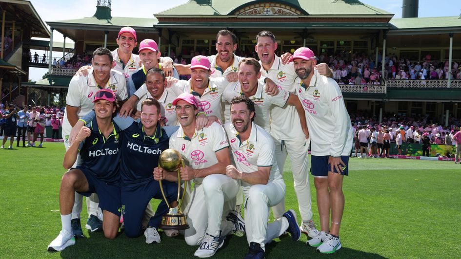 The Australian team pose with the Border Gavaskar Trophy