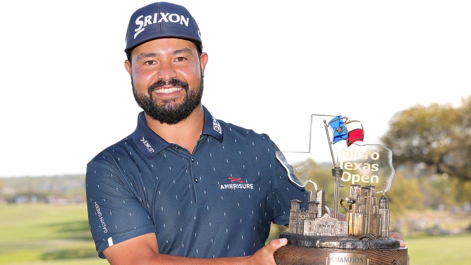 J.J. Spaun celebrates with the trophy after winning the Valero Texas Open