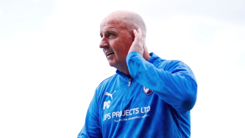 Chesterfield manager Paul Cook cups his ear