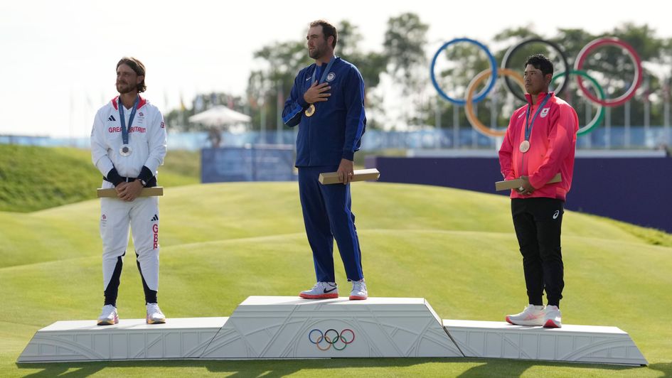 Gold medalist Scottie Scheffler with Tommy Fleetwood and Hideki Matsuyama