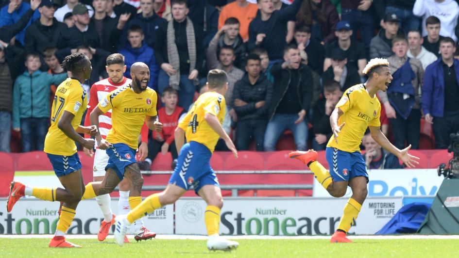 Lyle Taylor celebrates his goal against Doncaster