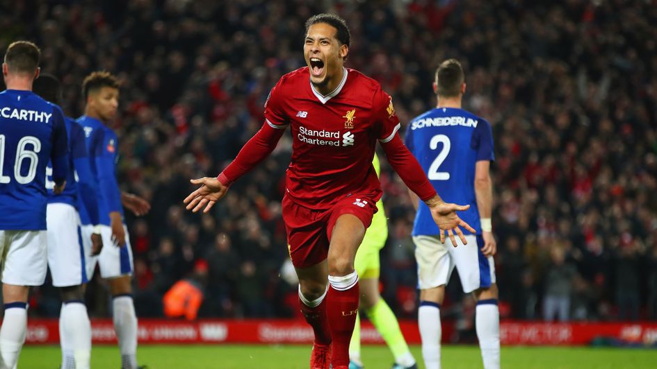 Virgil van Dijk celebrates after a late header against Everton