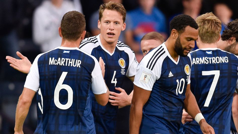 Christophe Berra and Scotland celebrate