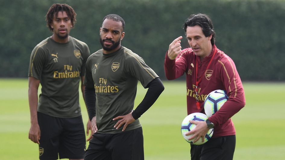 Unai Emery: Arsenal boss (right) instructs his players in training