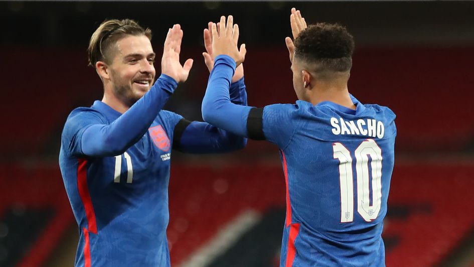 Jack Grealish and Jadon Sancho celebrate