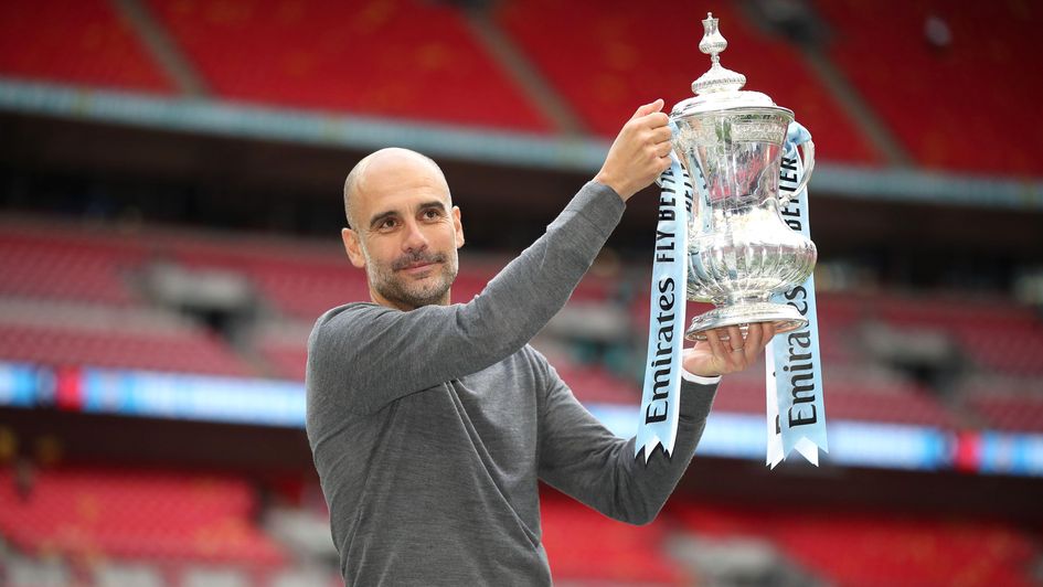 Pep Guardiola with the FA Cup trophy