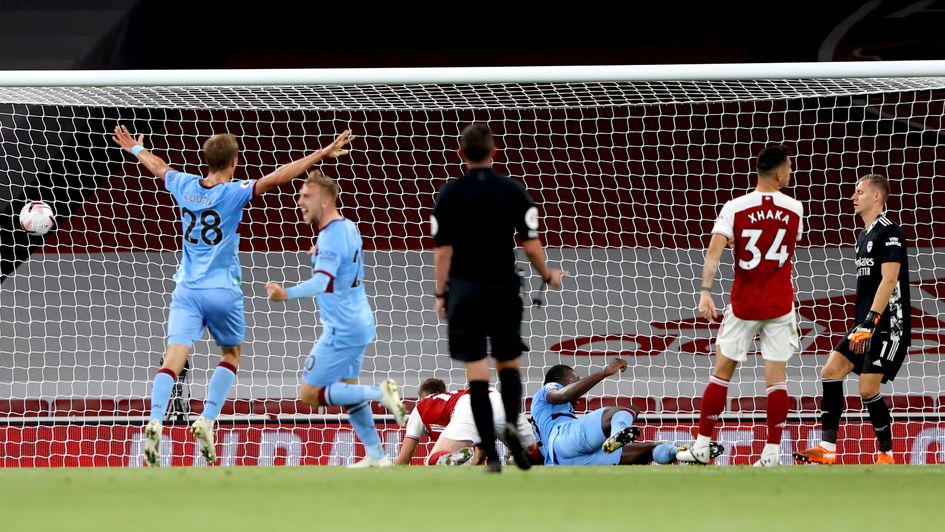 Michail Antonio (third right, floor) scores at the Emirates