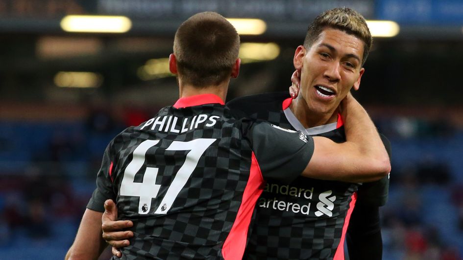 Roberto Firmino and Nat Phillips celebrate