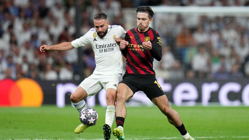 Dani Carvajal battles for possession with Jack Grealish