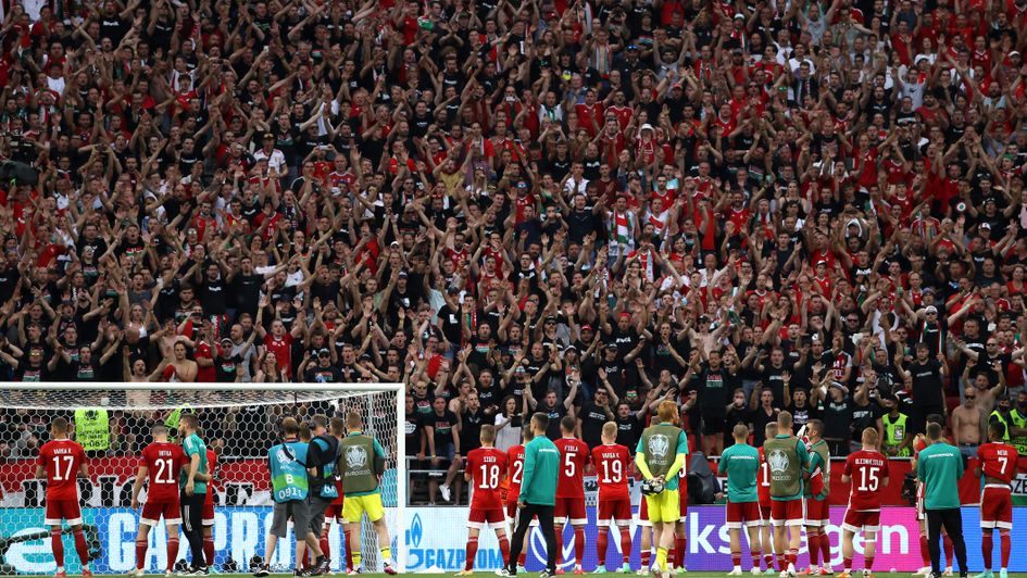 Hungary fans applaud their team following defeat