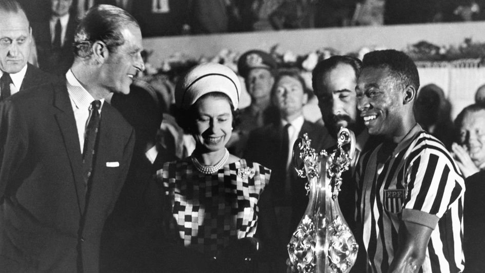 Queen Elizabeth II and Prince Philip present a cup to Pele in 1968