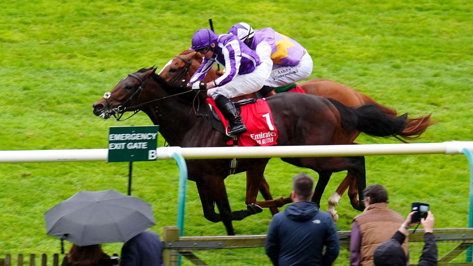 Delacroix ridden by Ryan Moore (nearside) coming home to win the Emirates Autumn Stakes