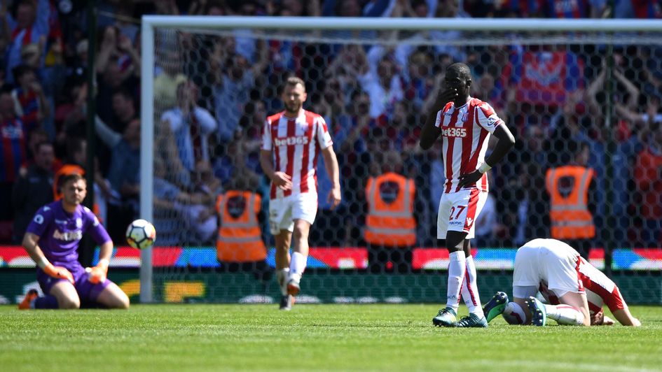 Stoke City's players look dejected as they're relegated from the Premier League