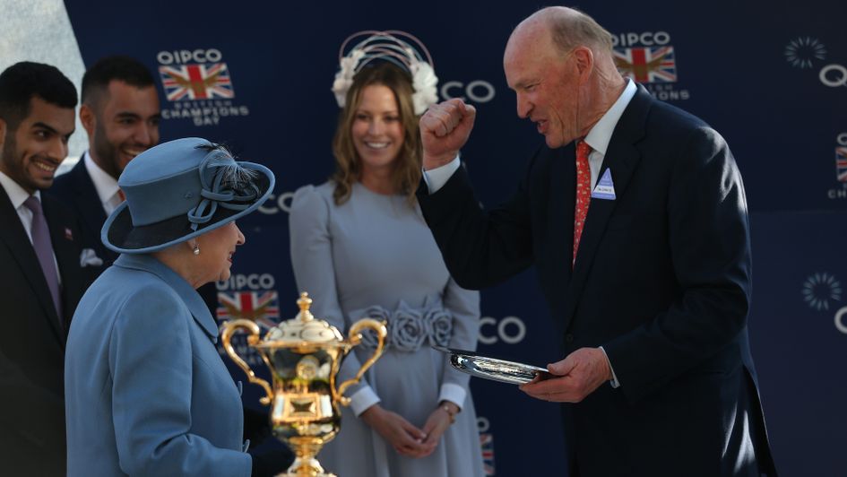 John Gosden receives a trophy from The Queen at Ascot