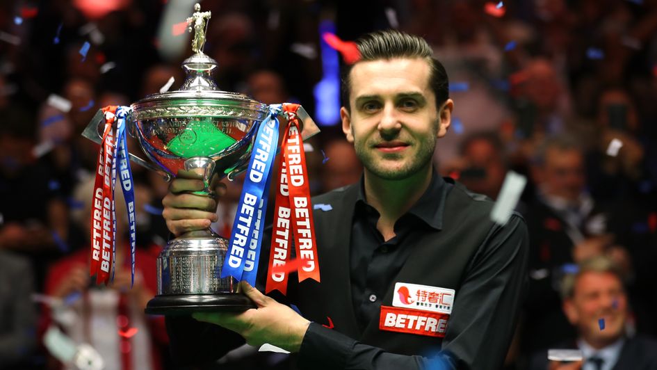 Mark Selby lifts the trophy