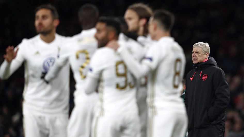 Ostersunds celebrate as Arsene Wenger looks on