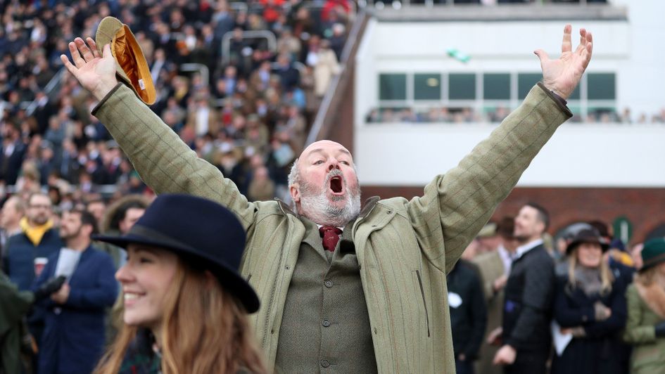 A racegoer celebrates after the Ryanair Chase