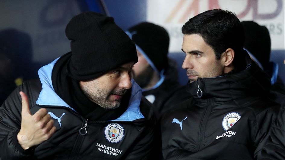 Manchester City boss Pep Guardiola with assistant Mikel Arteta