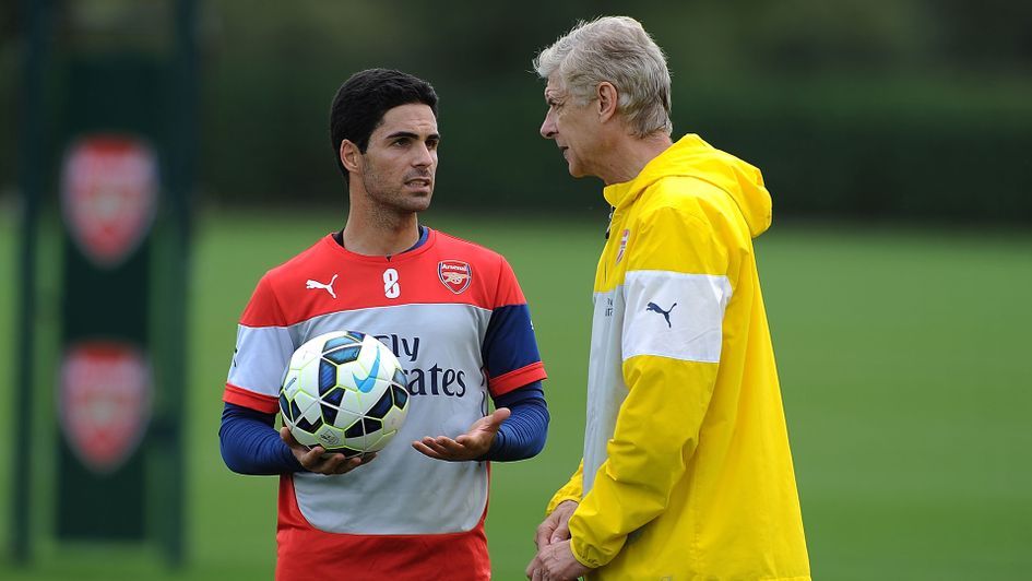 Mikel Arteta with Arsene Wenger in 2014