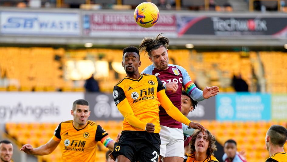 Nelson Semedo and Jack Grealish battle for the ball