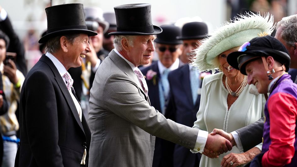 His Majesty The King shakes the hand of Desert Hero's jockey Tom Marquand