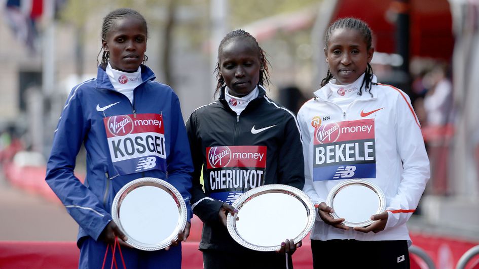 Kenya's Vivan Cheruiyot (centre) poses with the trophy after winning the 2018 Women's London Marathon alongside second placed Kenya's Brigid Kosgei (left) and third placed Ethopia's Tadelech Bekele