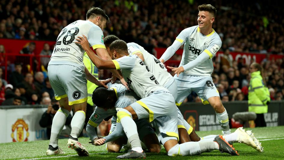 Derby players celebrate at Old Trafford